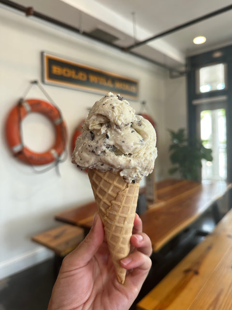 Hand holding a cone with ice cream at Bold Mariner Brewery