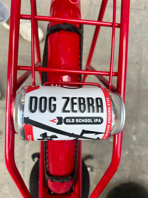Dog Zebra Old School IPA can on a red bike rack