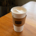 White cup with hot london fog on a wooden table
