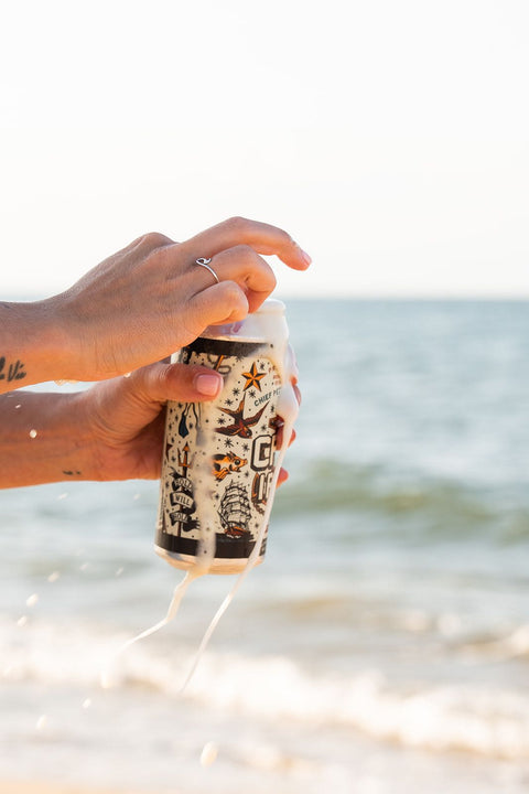 Opening Bold Mariner beer at ocean in Virginia Beach