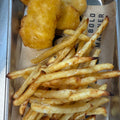 Fried chicken nuggets and fries in a metal tray at Bold Mariner