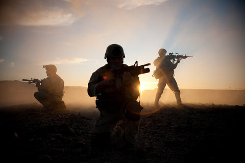 Navy Seals standing with guns